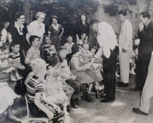 Ed Sullivan greeting students of the Cerebral Palsy Center as part of a fundraising campaign in 1954