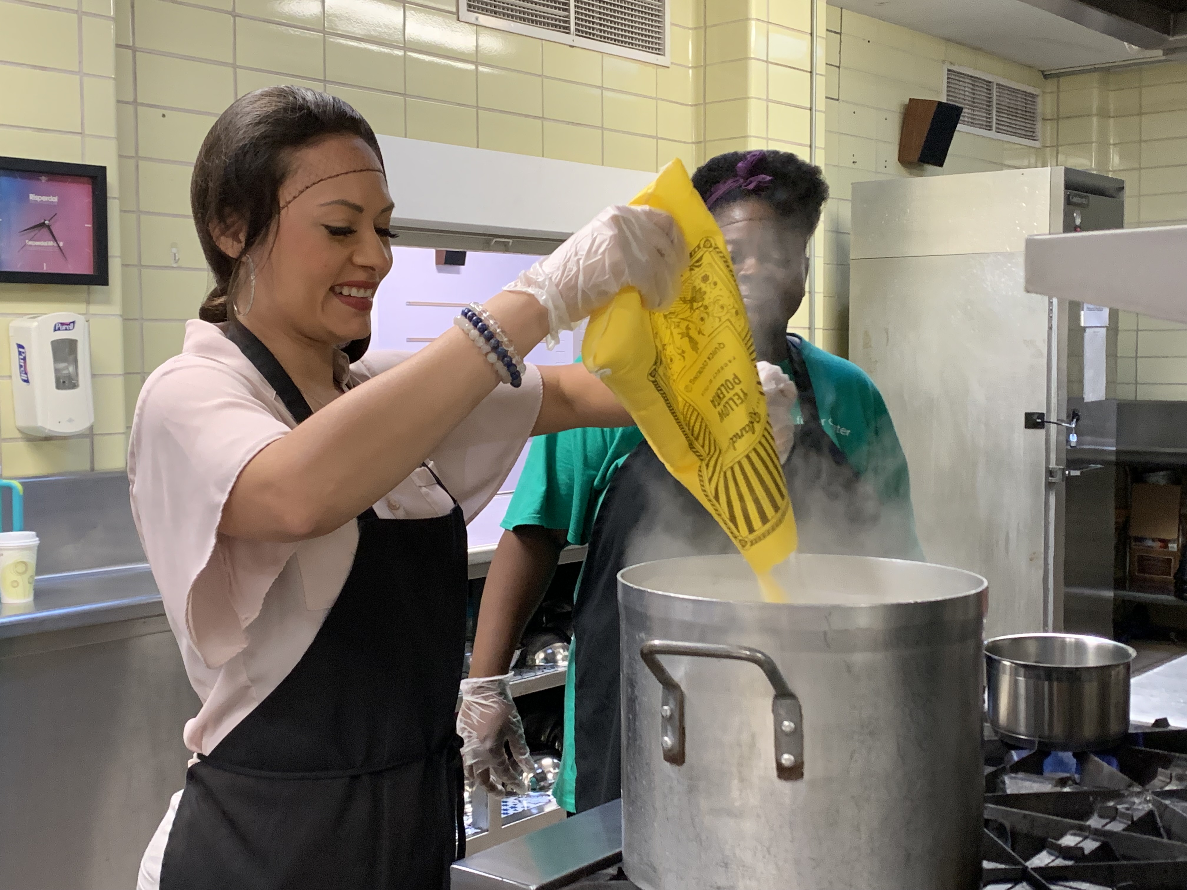 Ashley preparing Harina de Maiz, with help from Kitchen Assistant LaTonya Colzie