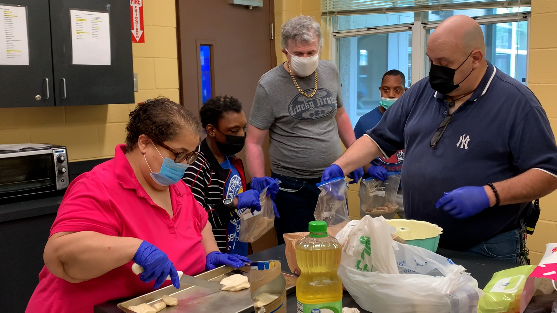 Steve and some adult participants making monkey bread.