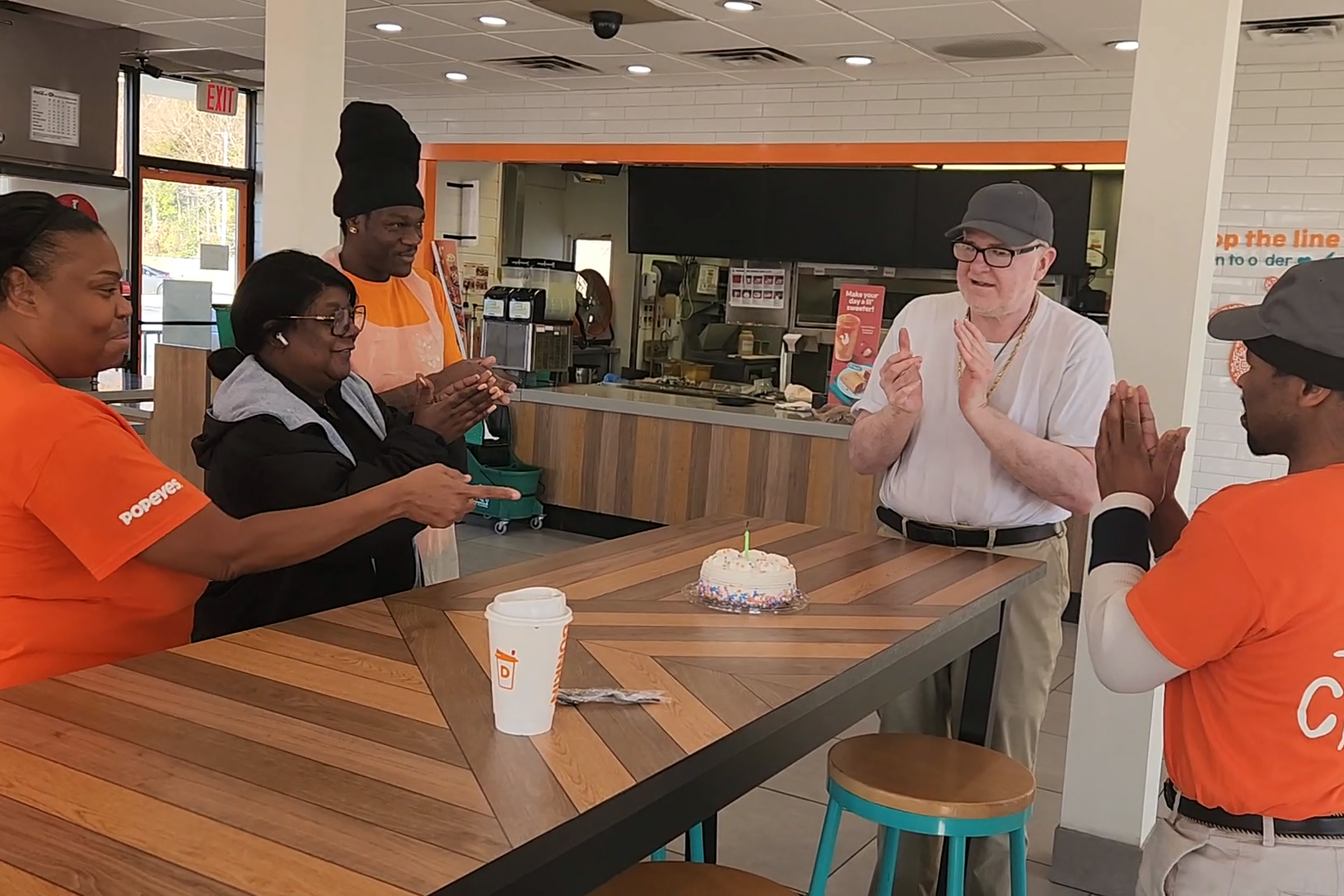 Patrick (2nd from R), an adult participant in our Supported Employment program, celebrates his birthday with his Popeyes co-workers, including fellow Frazer adult participant, Antonio (R)