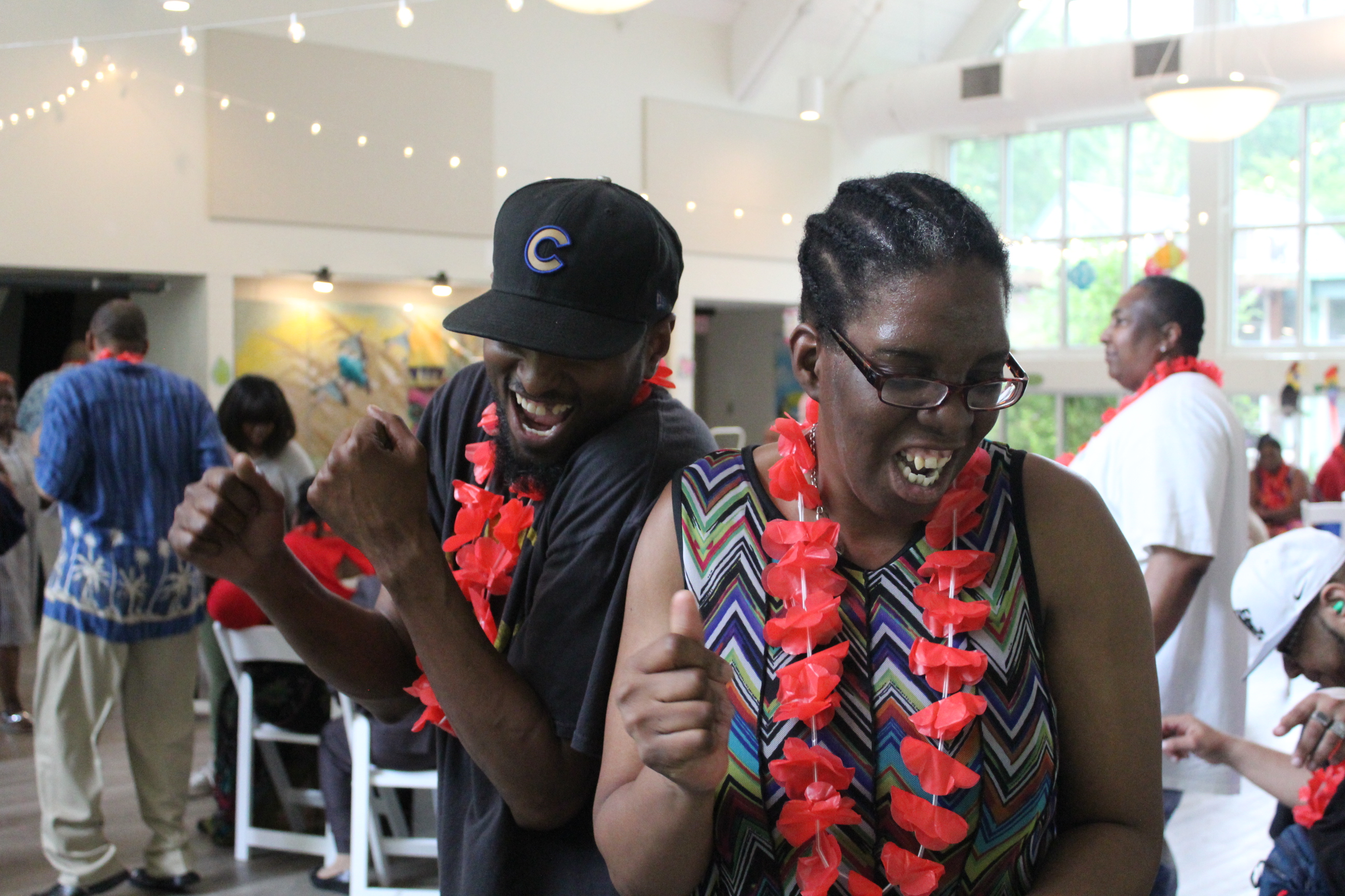 Eric and Adult Program participants enjoying a recent luau dance party