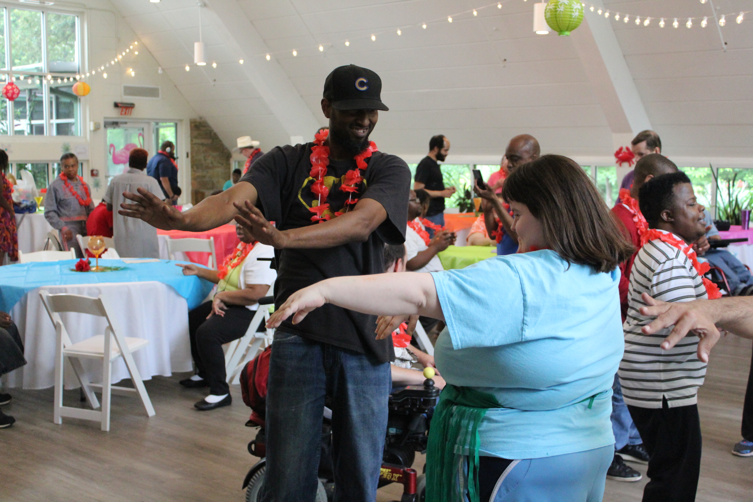 Eric and Adult Program participants enjoying a recent luau dance party