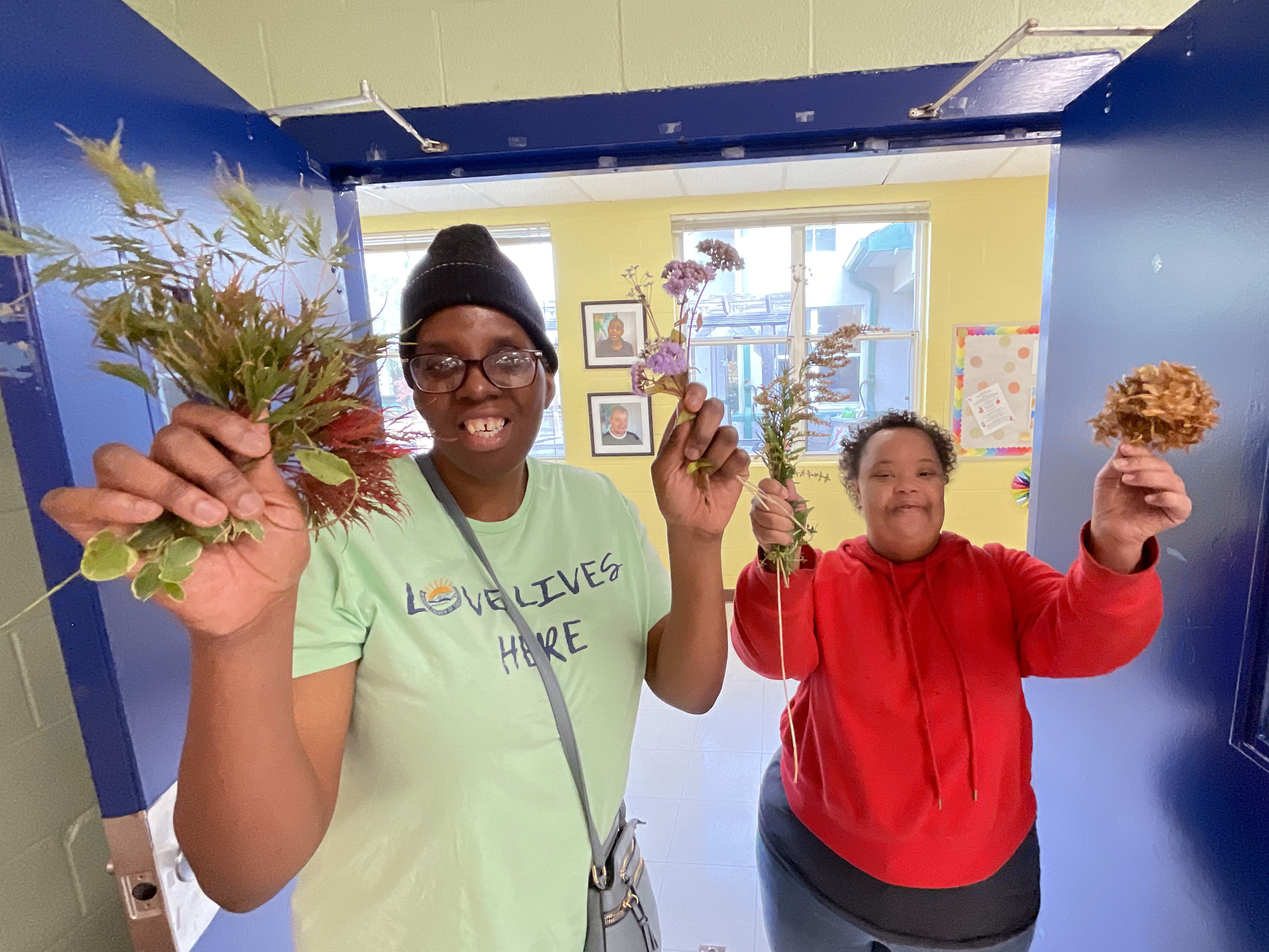 Frazer Center adult participants gathering botanicals for crafting ornaments for Frazer’s entry in the Georgia Festival of Trees