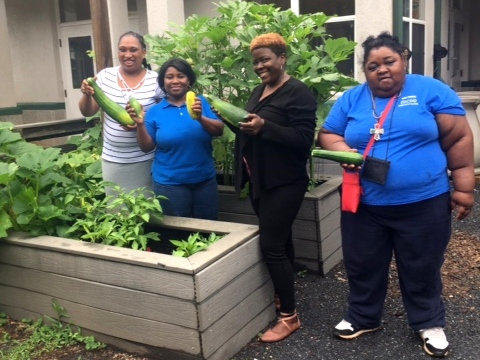 (L-R) Meshelle, June, DSP Erica, and Kathren reaping the rewards of the garden