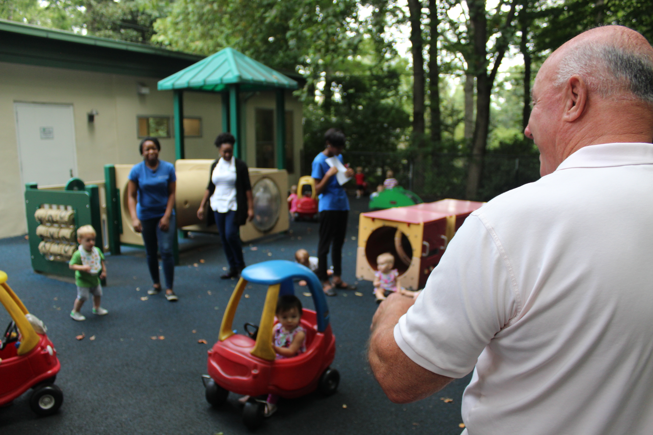 George visiting the playground and meeting some teachers