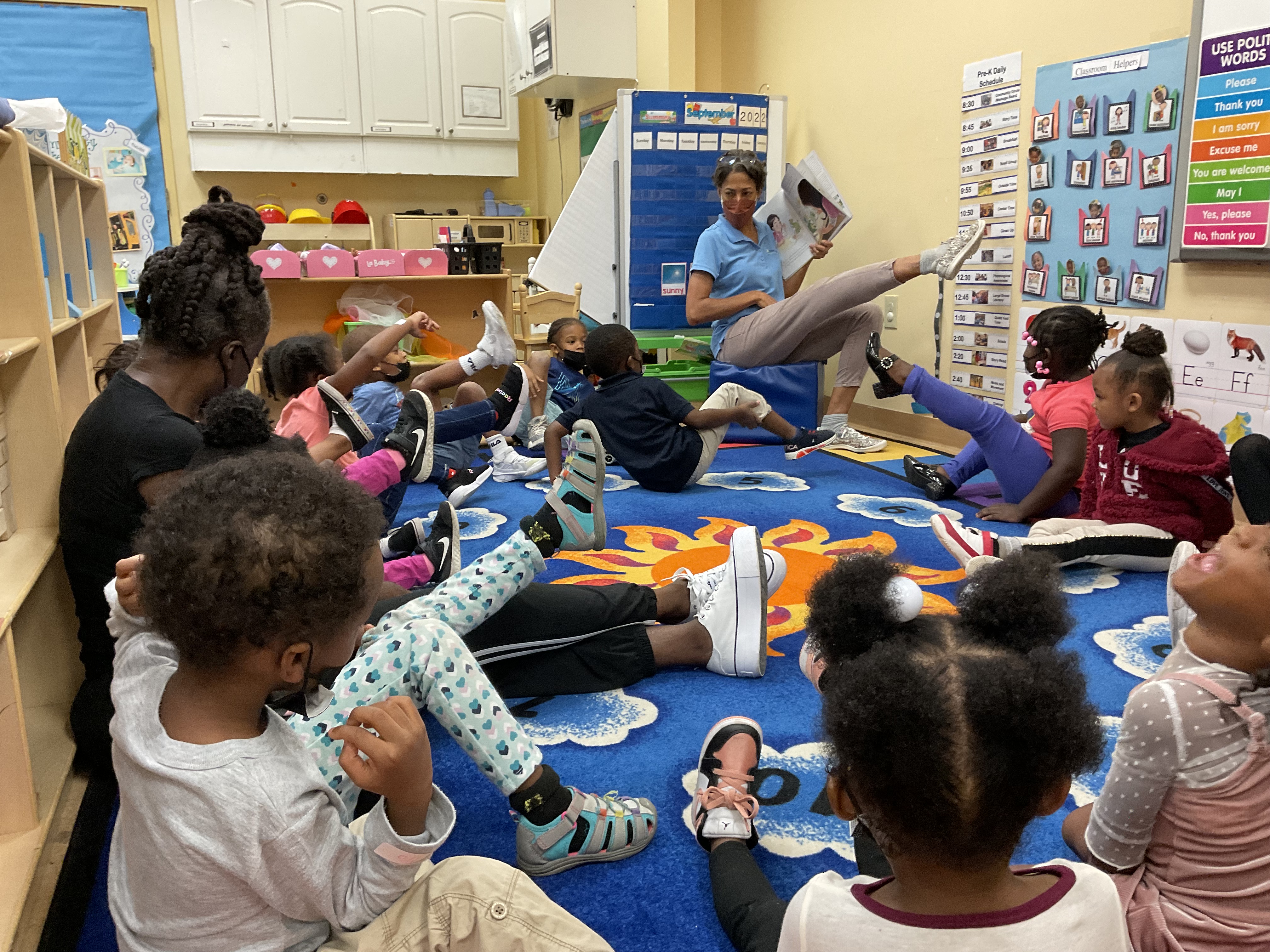 Frazer's Ms Kim begins by reading Pipsie: Nature Detective to the Our House children.