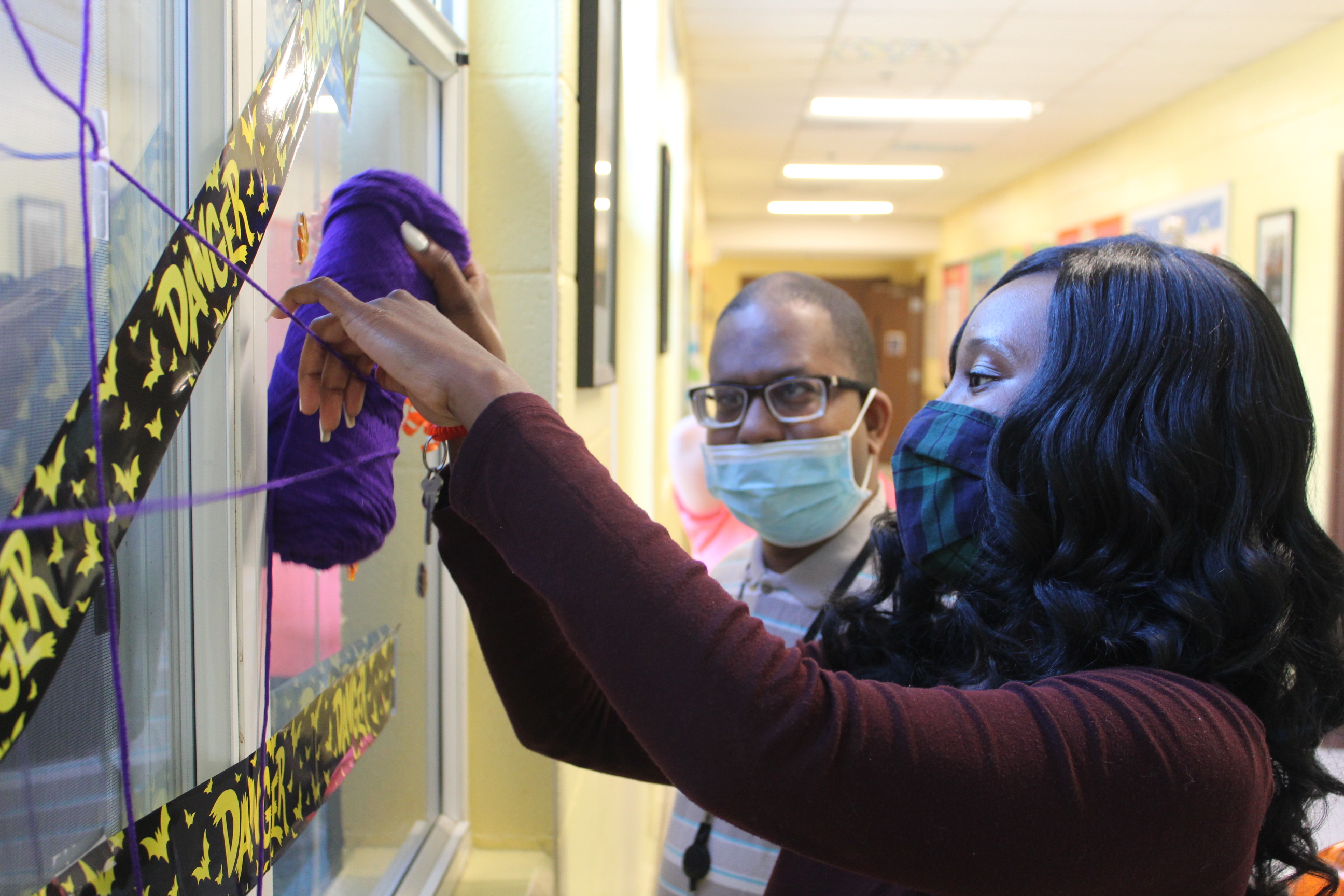 Zonetta and adult participant decorating for Halloween