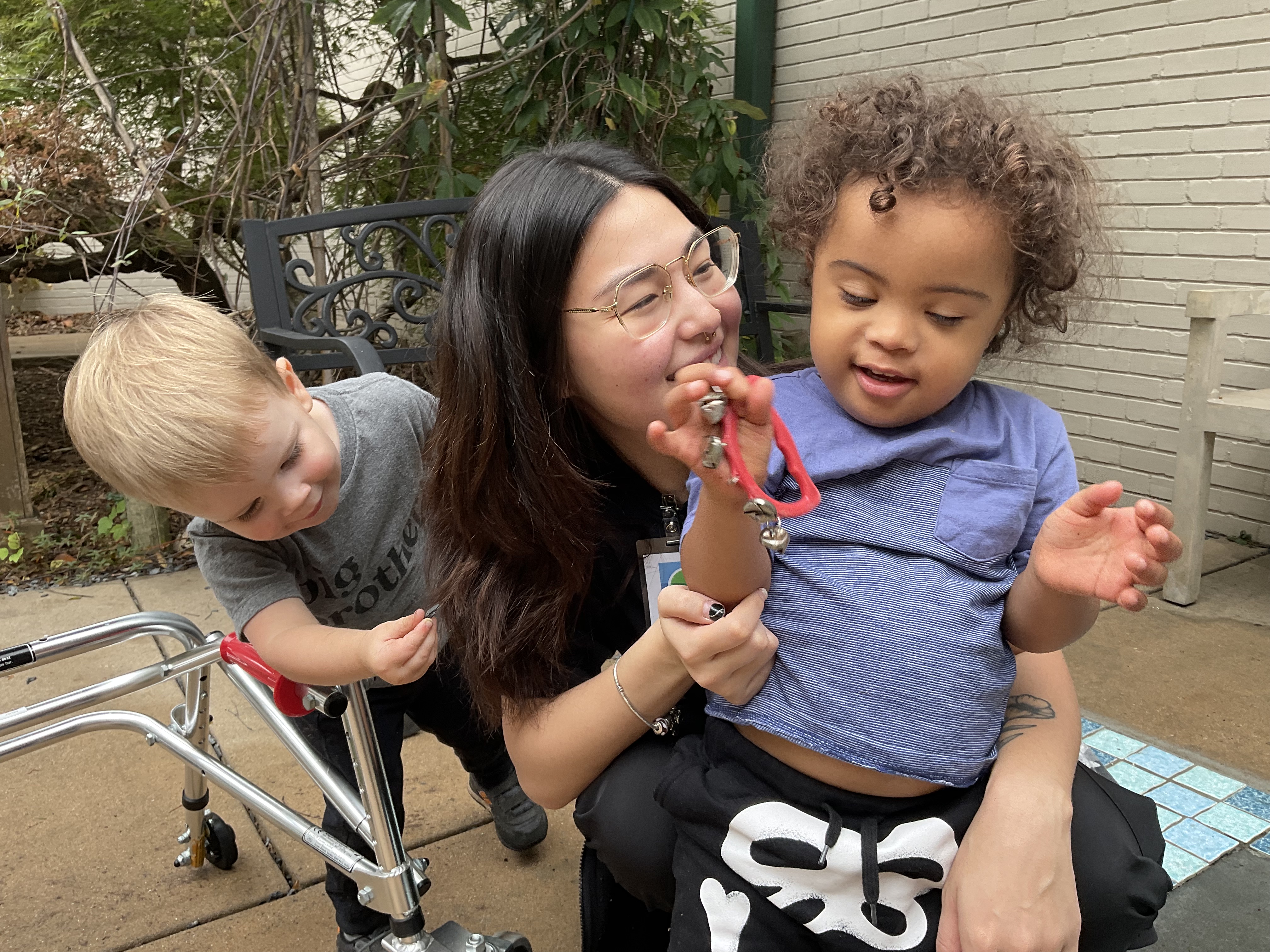 In the Sensory Garden with therapist, Debbie, and friend, William