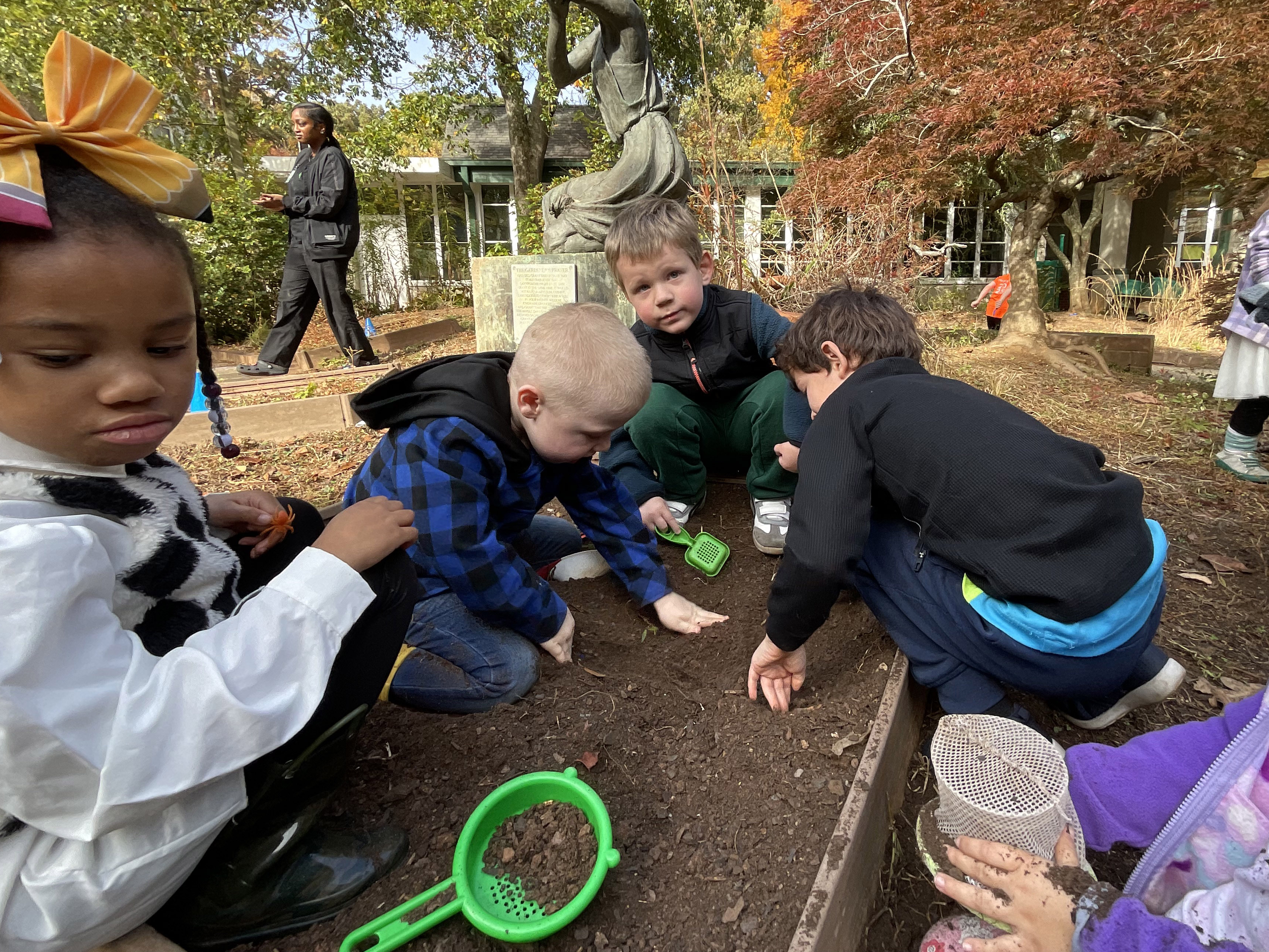 Leon playing with his friends in Frazer’s courtyard garden.
