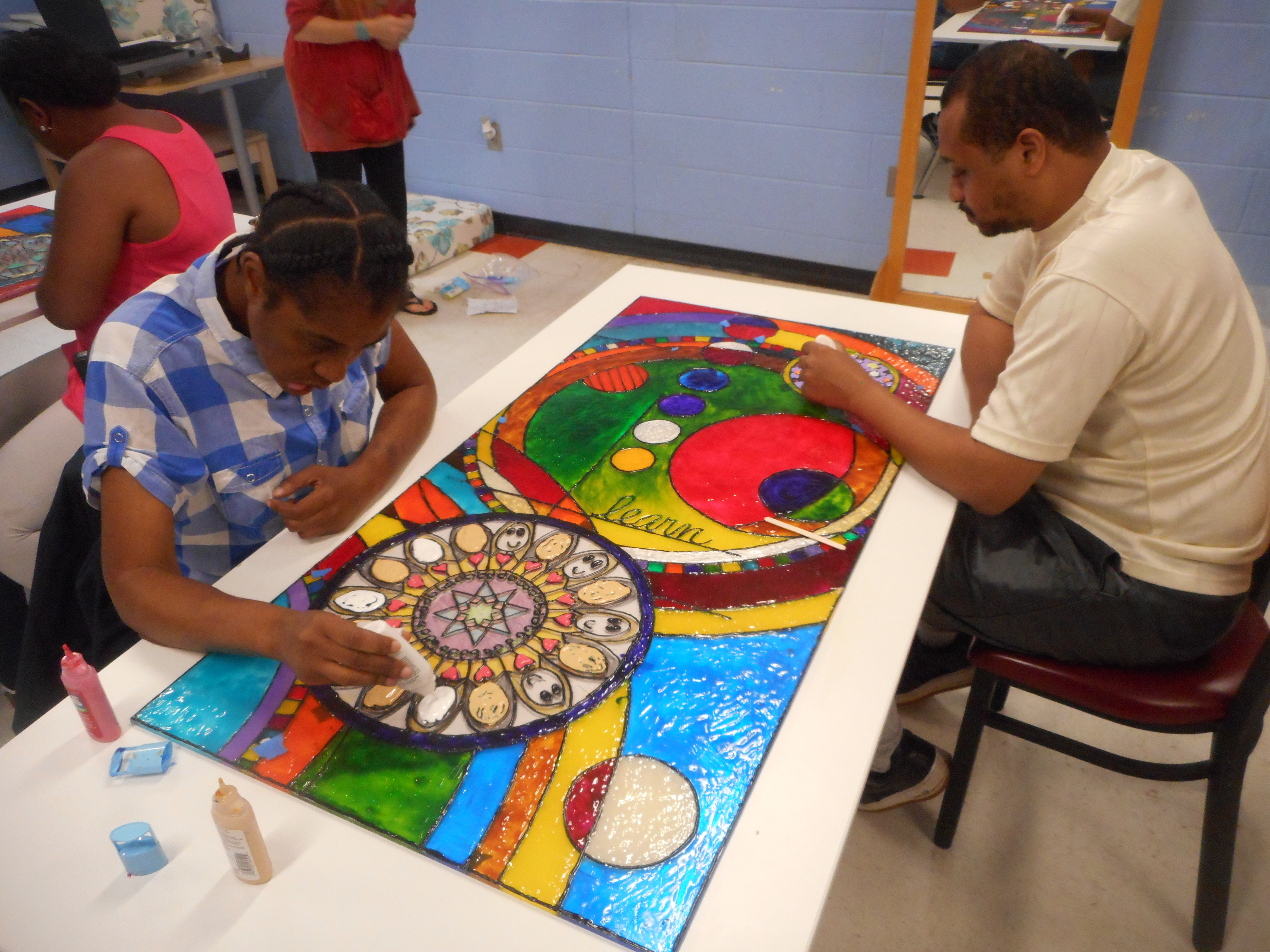 Adult Program participants working on the new art