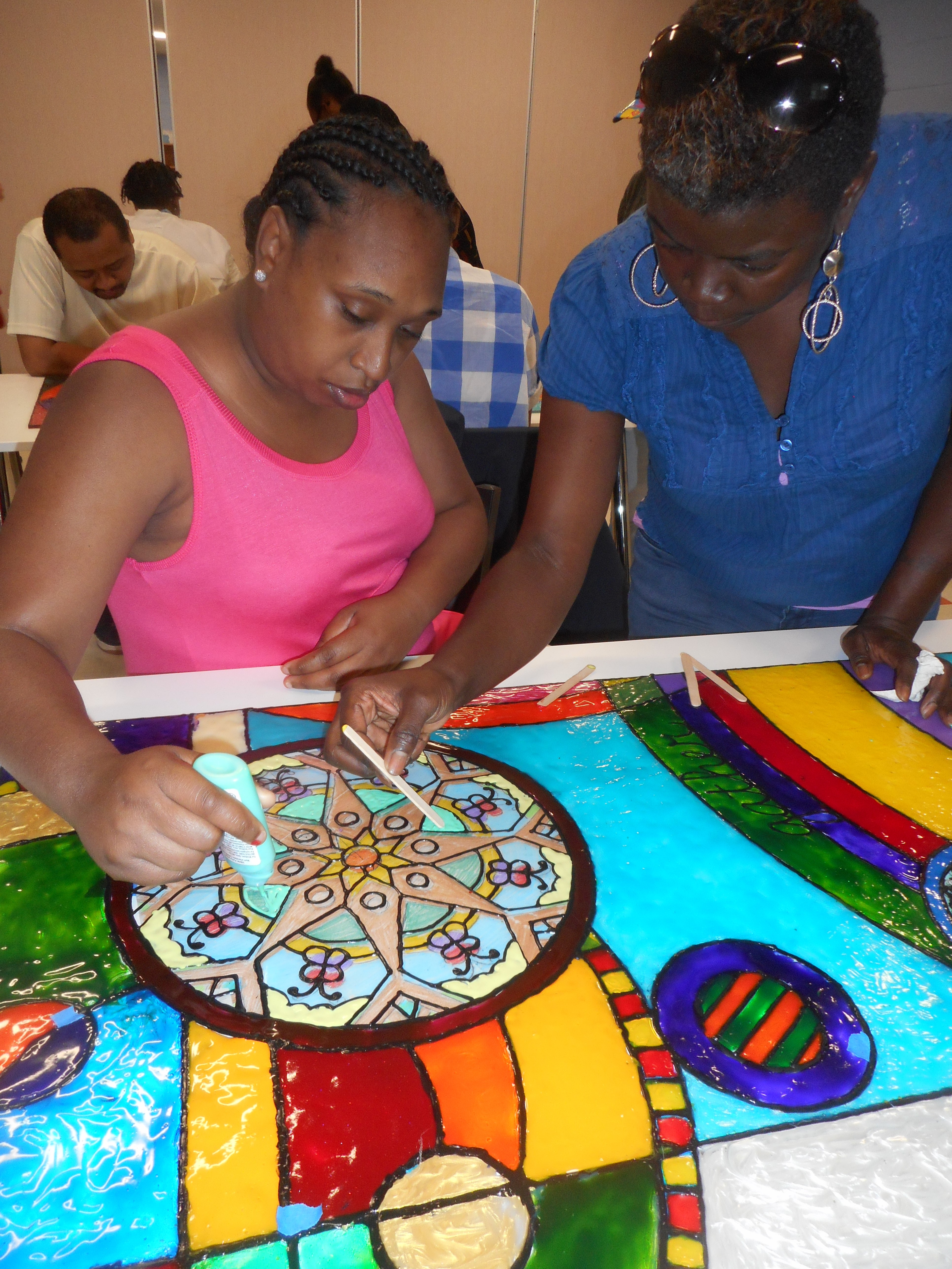 Adult Program staff and participants working on the new art