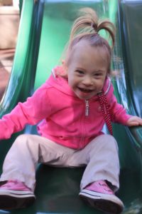 Lucy on the playground slide