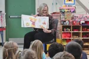 Pam McClure, Director of Child Development Program, reading to a Pre-K class