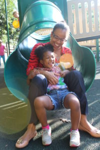 Phoenix got her mom to go down the slide with her.