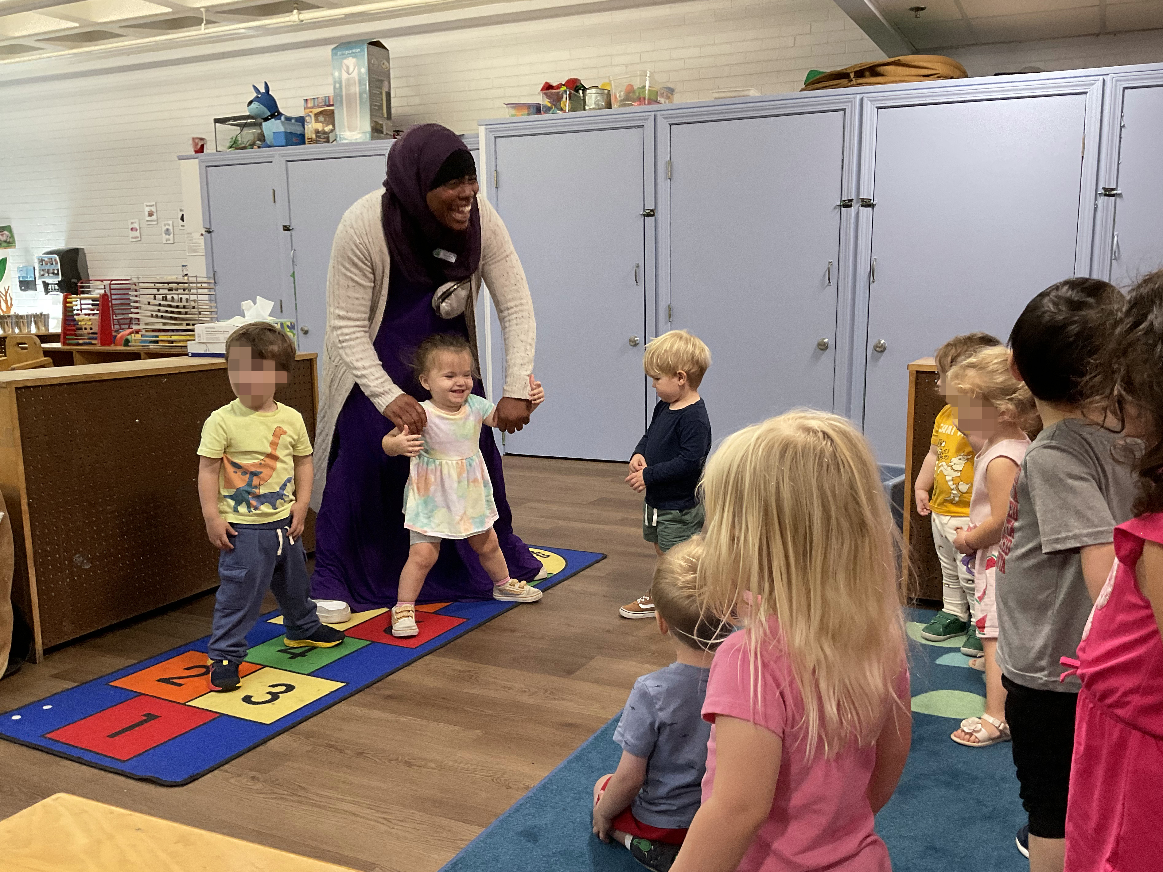Sahirah teaching some yoga poses to help the children regulate their feelings