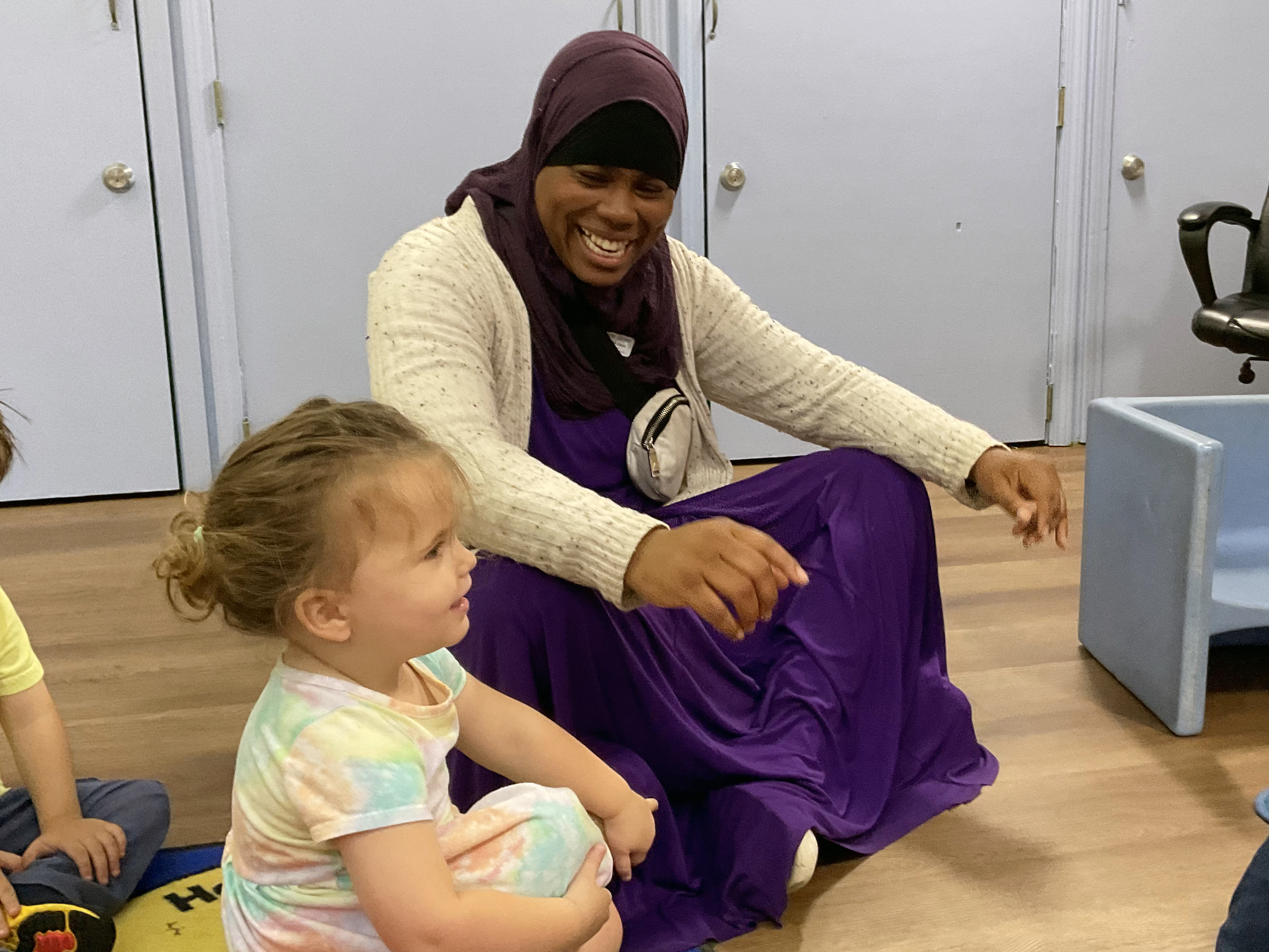 Sahirah Boyd working / playing with some toddlers