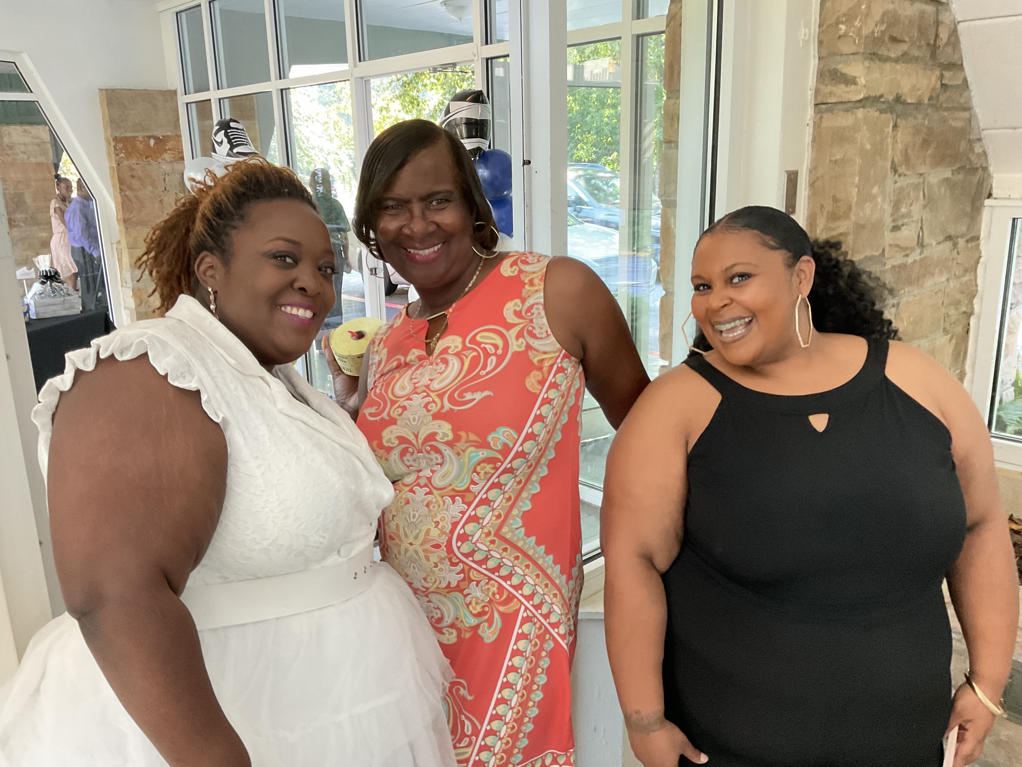 Sandra (center) with colleagues Unondus Walker (L) and Brittany Price (R) at the recent Sneaker Ball in Frazer’s atrium