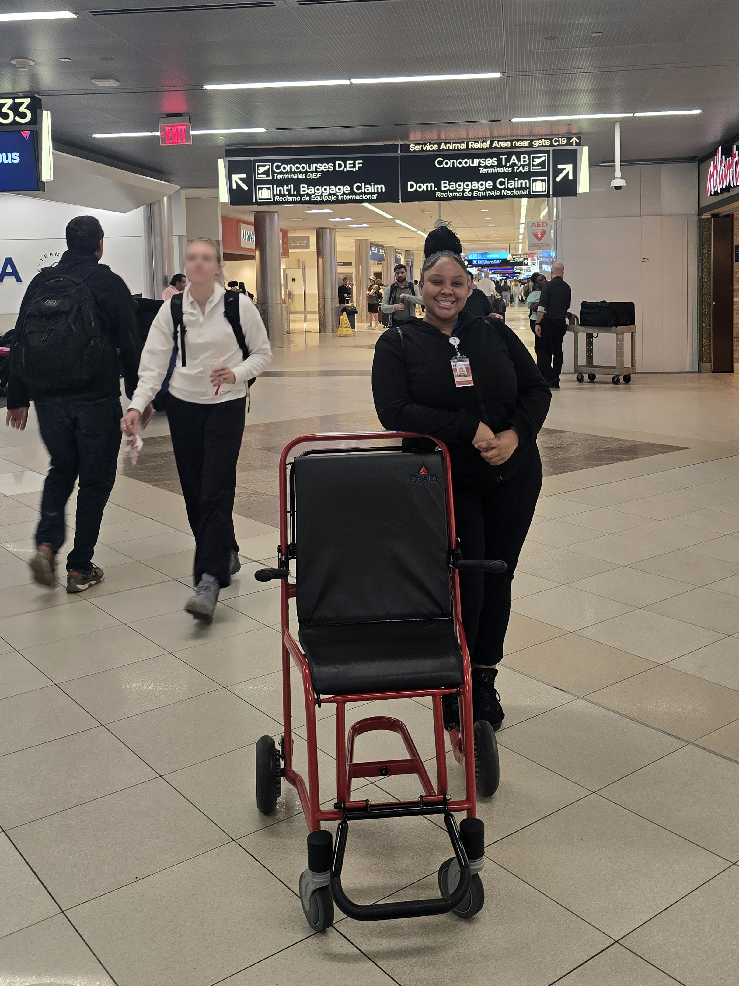 Aaliyah, a Frazer Center Supported Employment program participant, on the job at Hartsfield-Jackson International Airport
