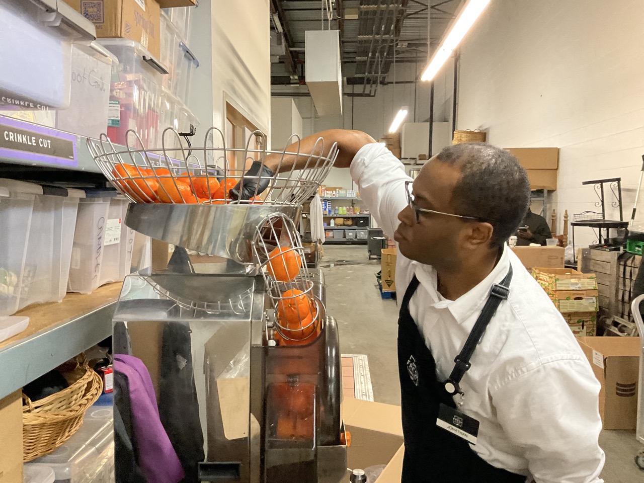 Jonathan making Fresh Market’s tangerine juice 