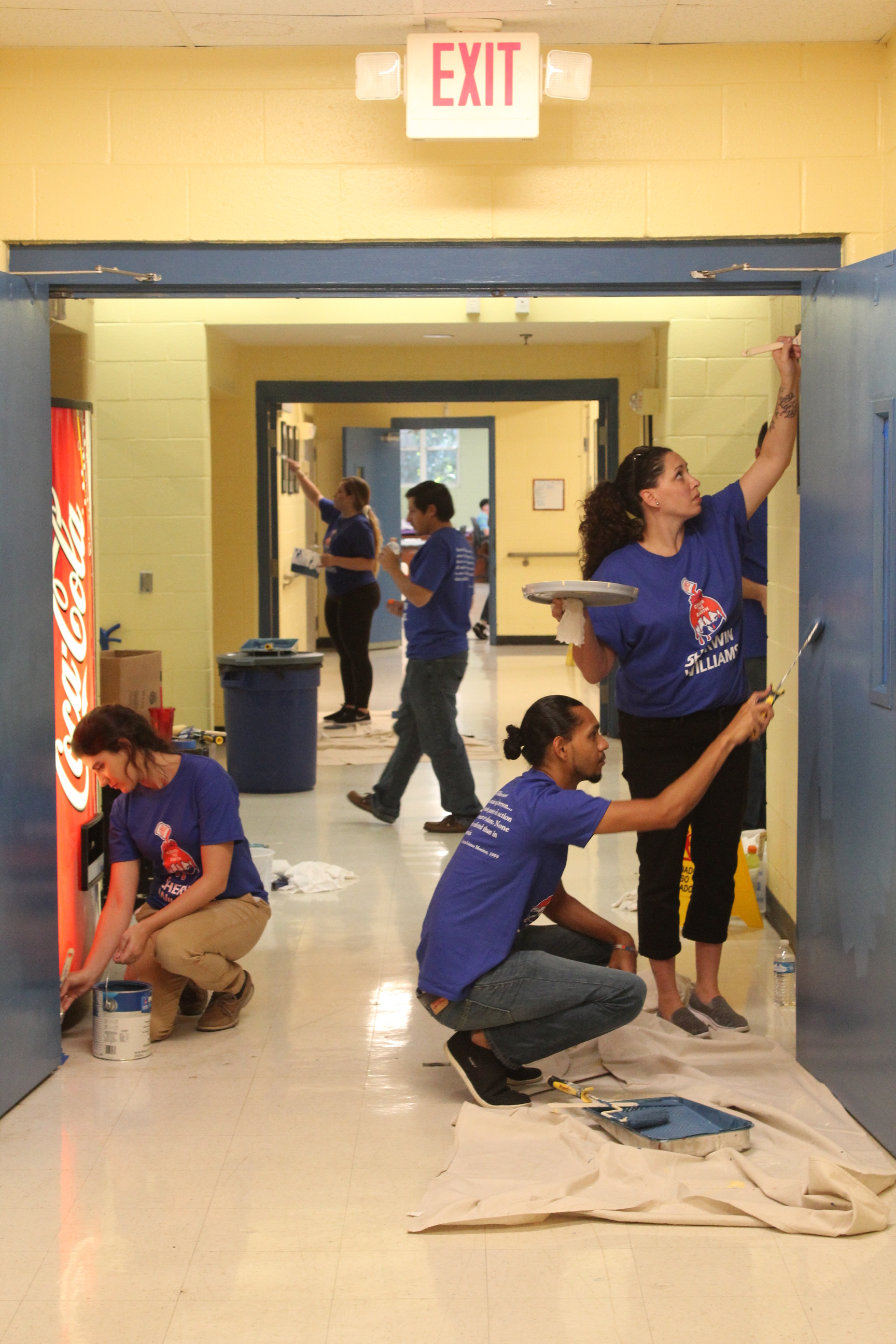 Sherwin Williams managers from across the Southeast touching up our hallways