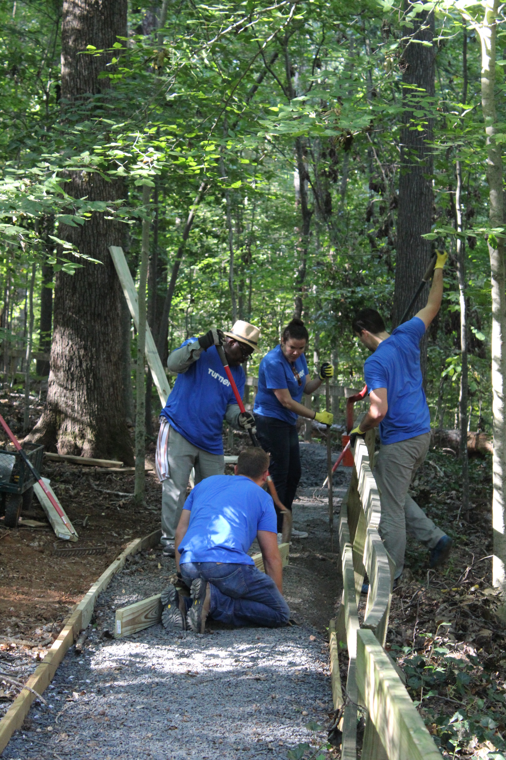 Turner employees doing some much-needed repairs along one of our walkways